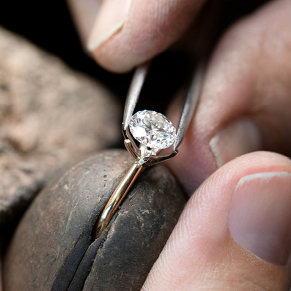 code of origin diamond being set in band