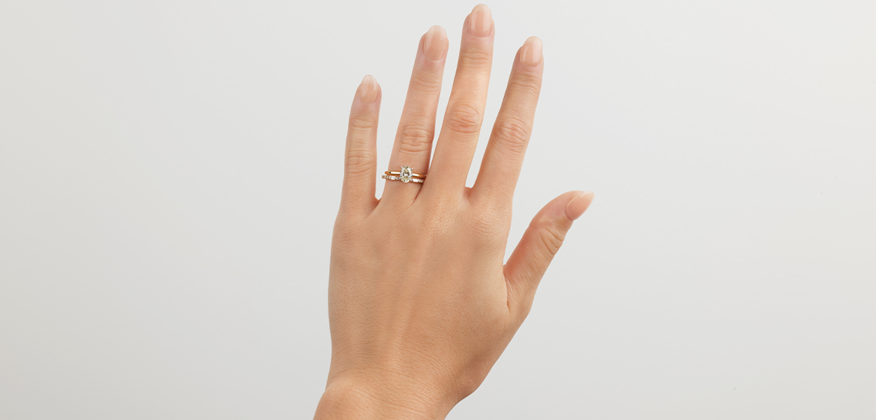 hands wearing multiple rings