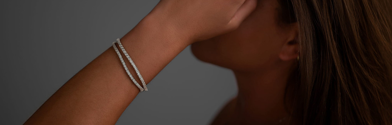 girl wearing diamond bracelets and rings