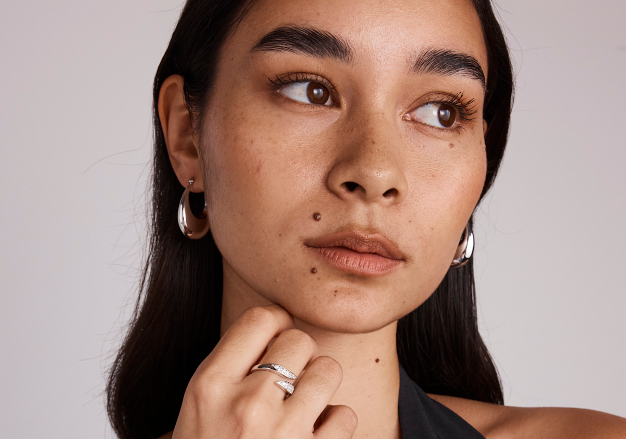 model wearing silver earrings