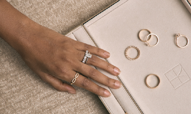 hand with various style engagement ring bands