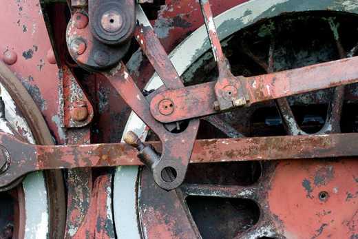Photograph of steam train wheel detail.