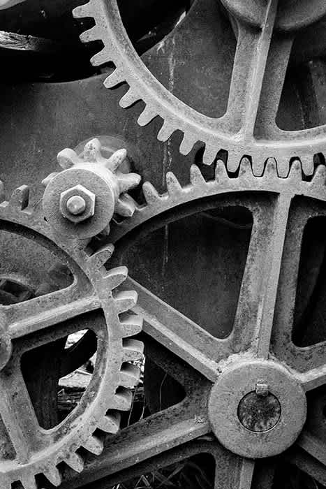 Photograph of old rusty gear wheels.