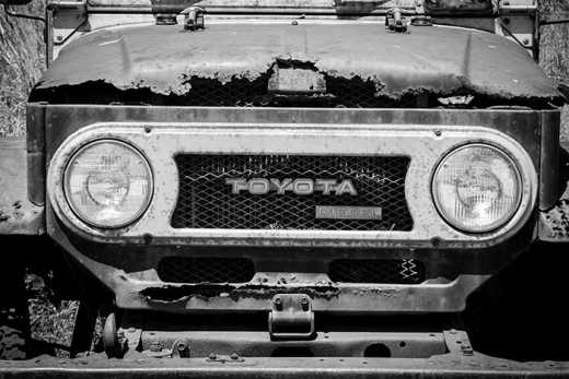 Photograph of bonnet of old rusty Toyota four wheel drive.