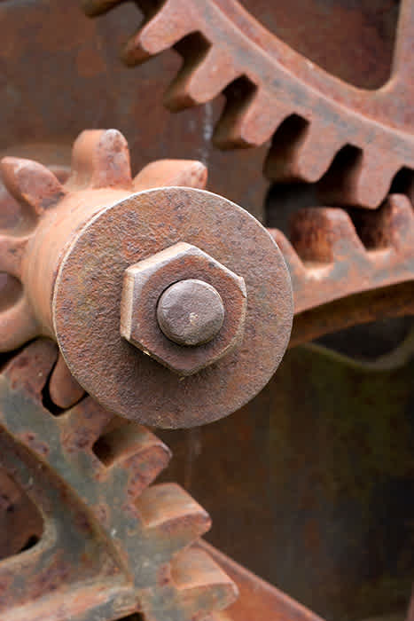 Photograph of rusting gears.