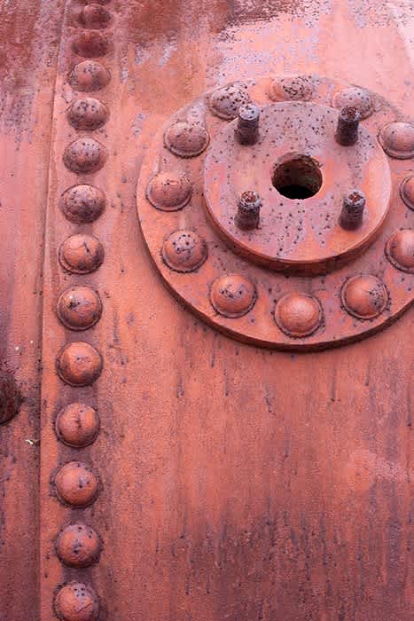 Photograph of rusting bolts (part of old boiler).
