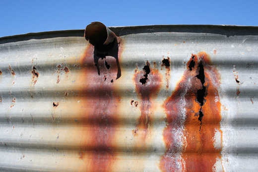 Photograph of old rusting water tank.