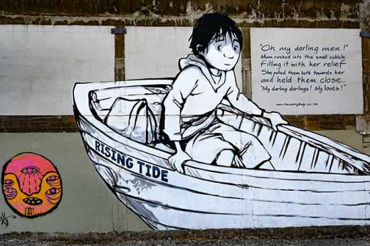Photograph of street art depicting a person in a small lifeboat.