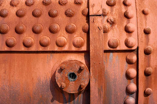 Photograph of old steam train boiler.