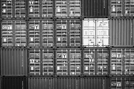 Black & White photograph of stacked cargo containers.
