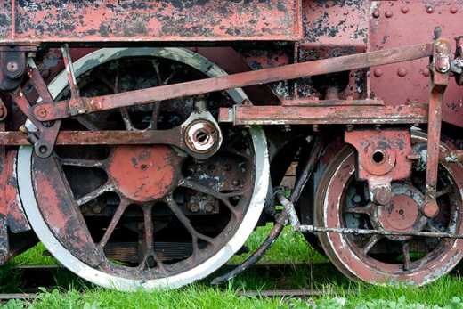 Photograph of steam engine train wheels.