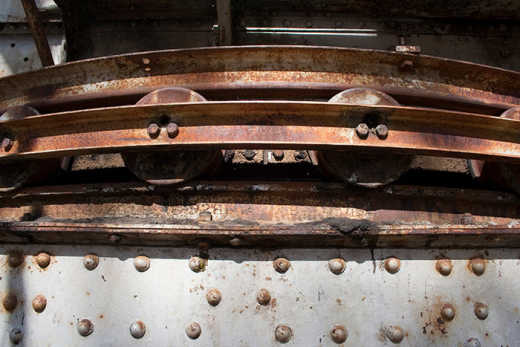 Photograph of old rusting part of crane.