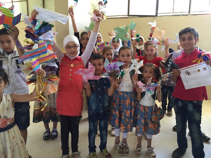Some of the pinwheels you made for the Healing Classrooms Challenge made their way to a Healing Classroom in Syria!