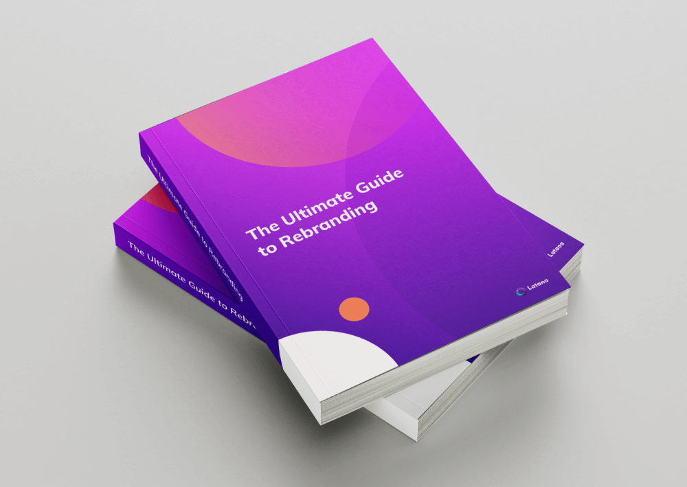 Pink and purple books with title of The Ultimate Guide to Rebranding