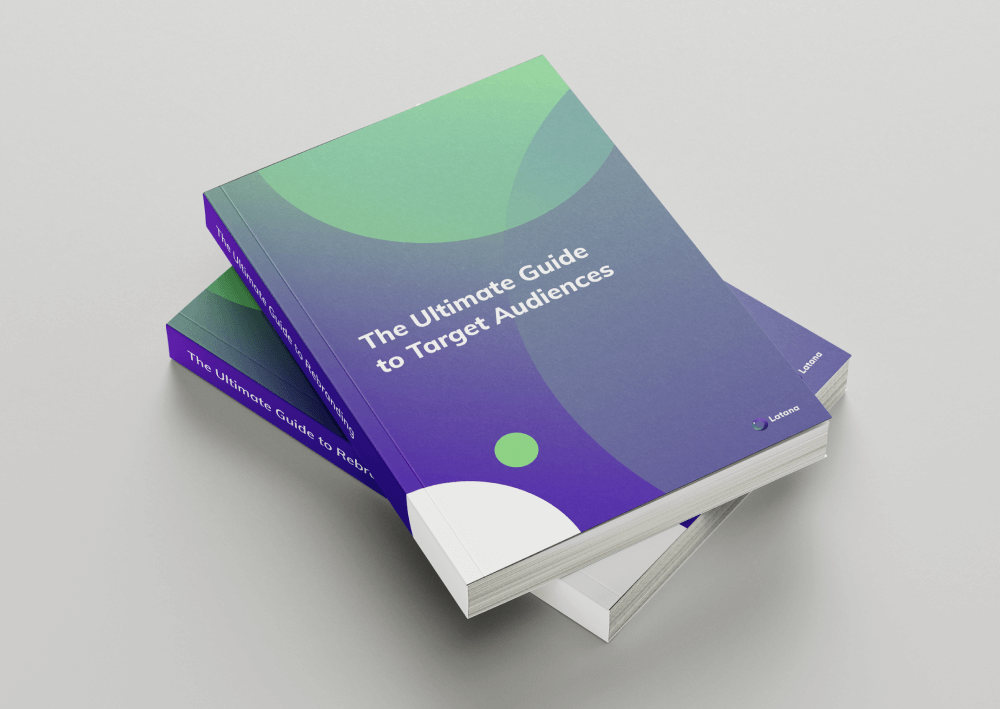 Green and purple books with title of The Ultimate Guide to Target Audiences