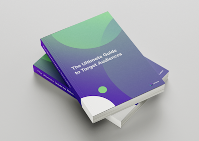 Green and purple books with title of The Ultimate Guide to Target Audiences