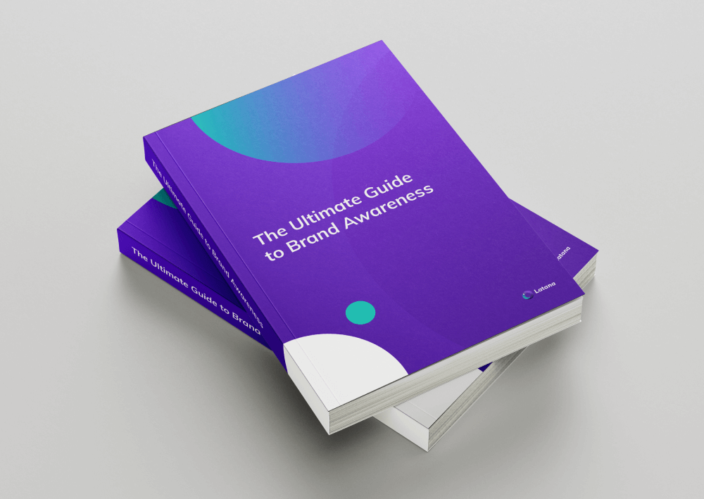 Green and purple books with title of The Ultimate Guide to Brand Awareness