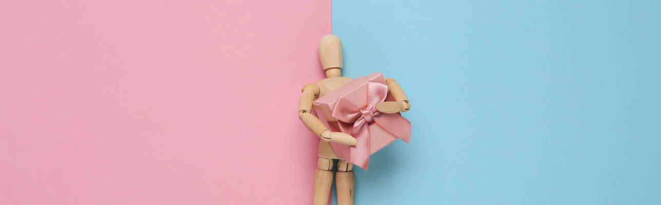 A wooden figure on a pink & blue background (cover image)