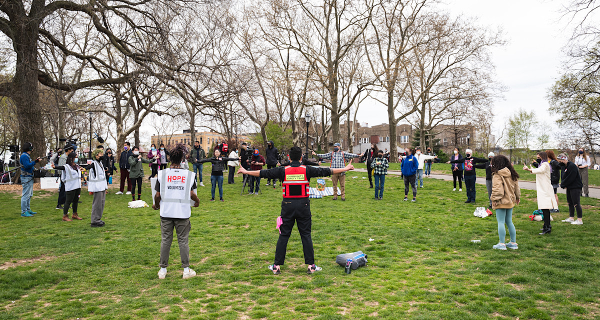 Image of AAF members in a circle in the park participating in a safety training