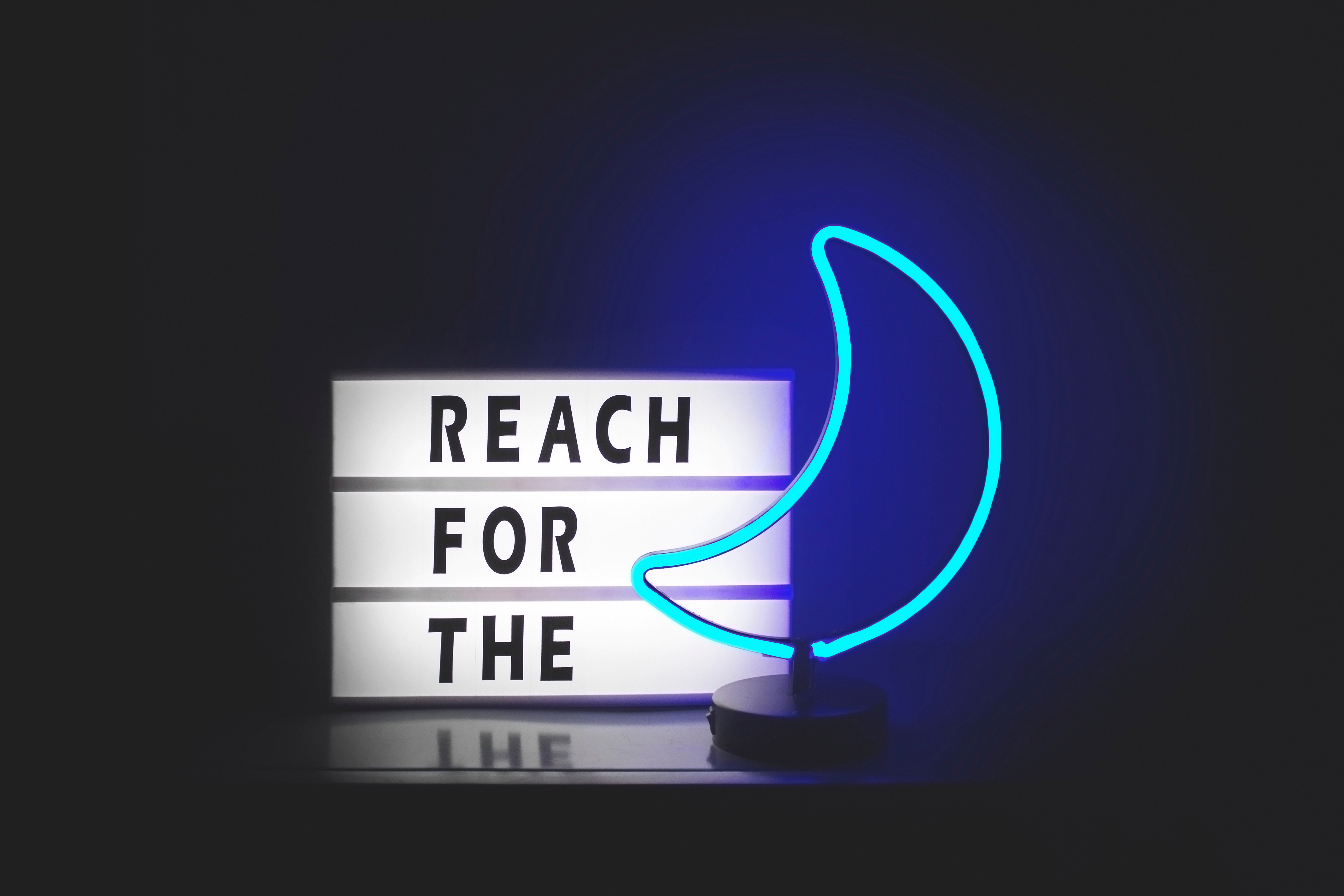 Reach for the moon neon sign