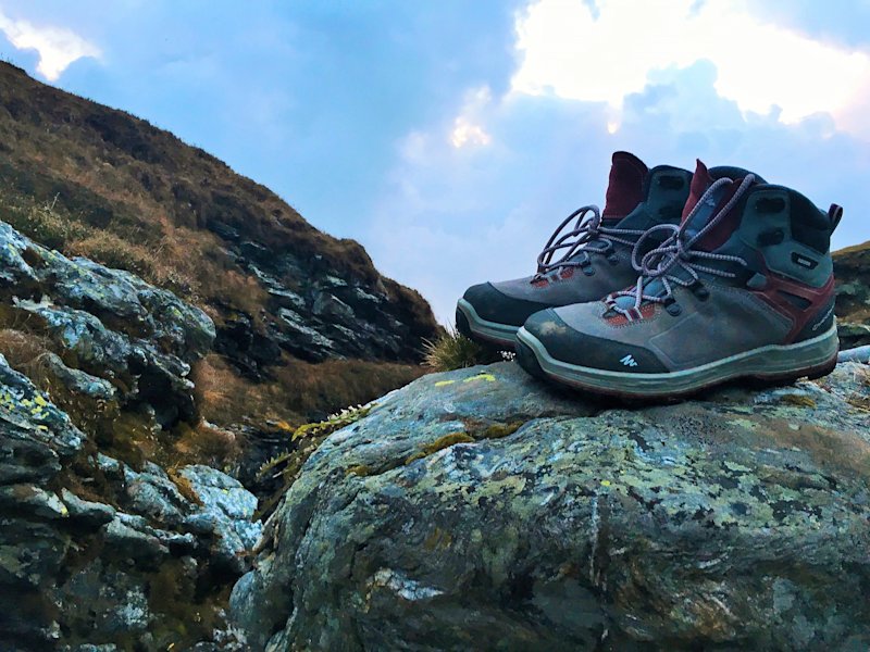 Trekking boots on a rock