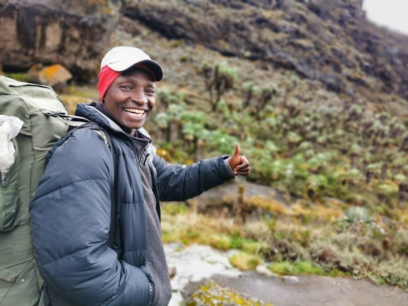 Florence smiling on Kilimanjaro in the heath zone