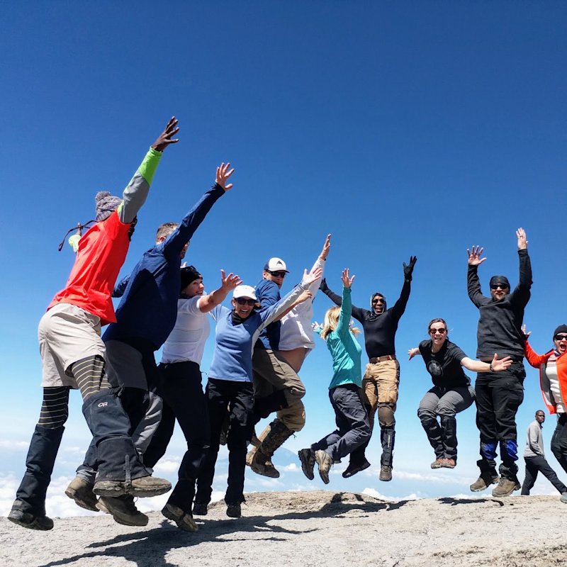 Group jump at top of Barranco Wall on Kilimanjaro