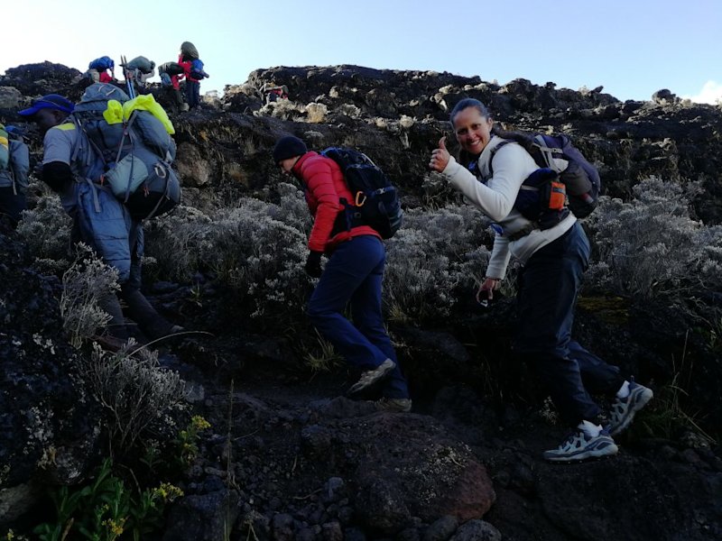 Trekkers climbing Barranco Wall