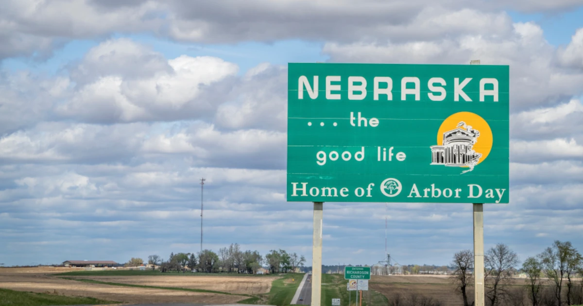 A welcome road sign for the state of Nebraska | Swyft Filings