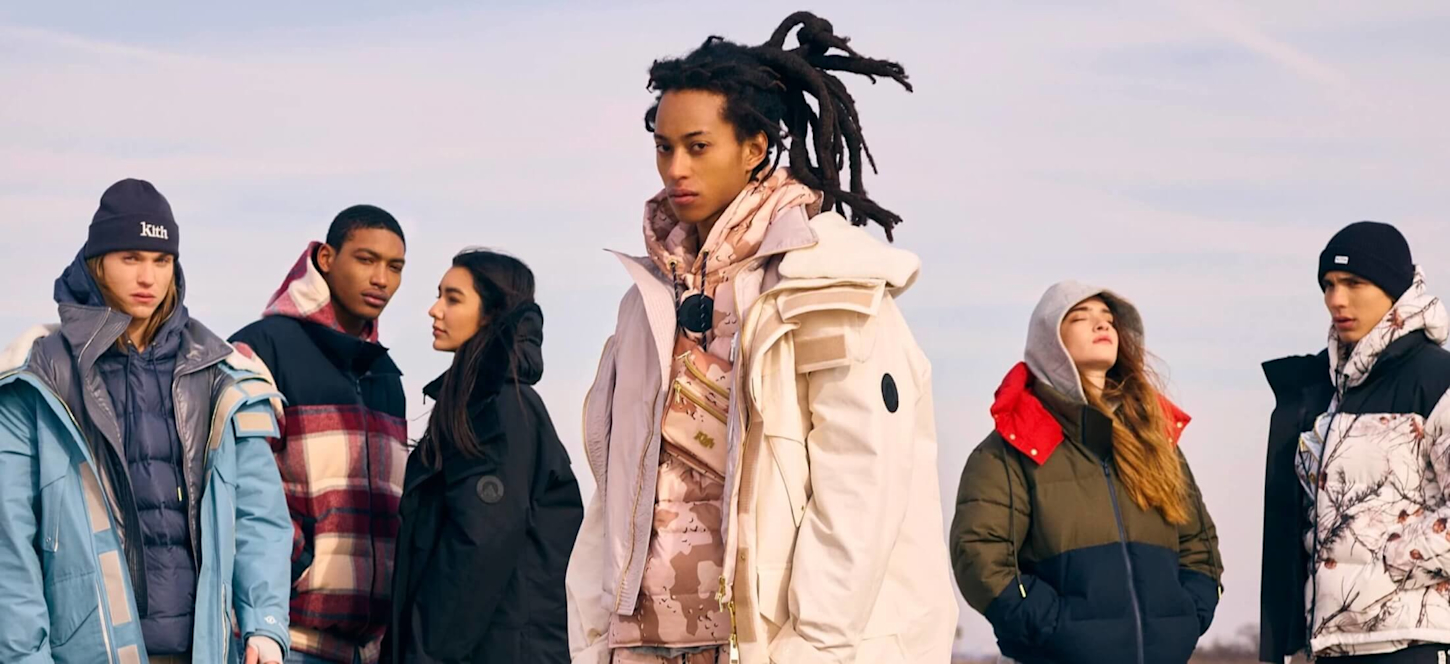 line of people wearing kith clothing outside