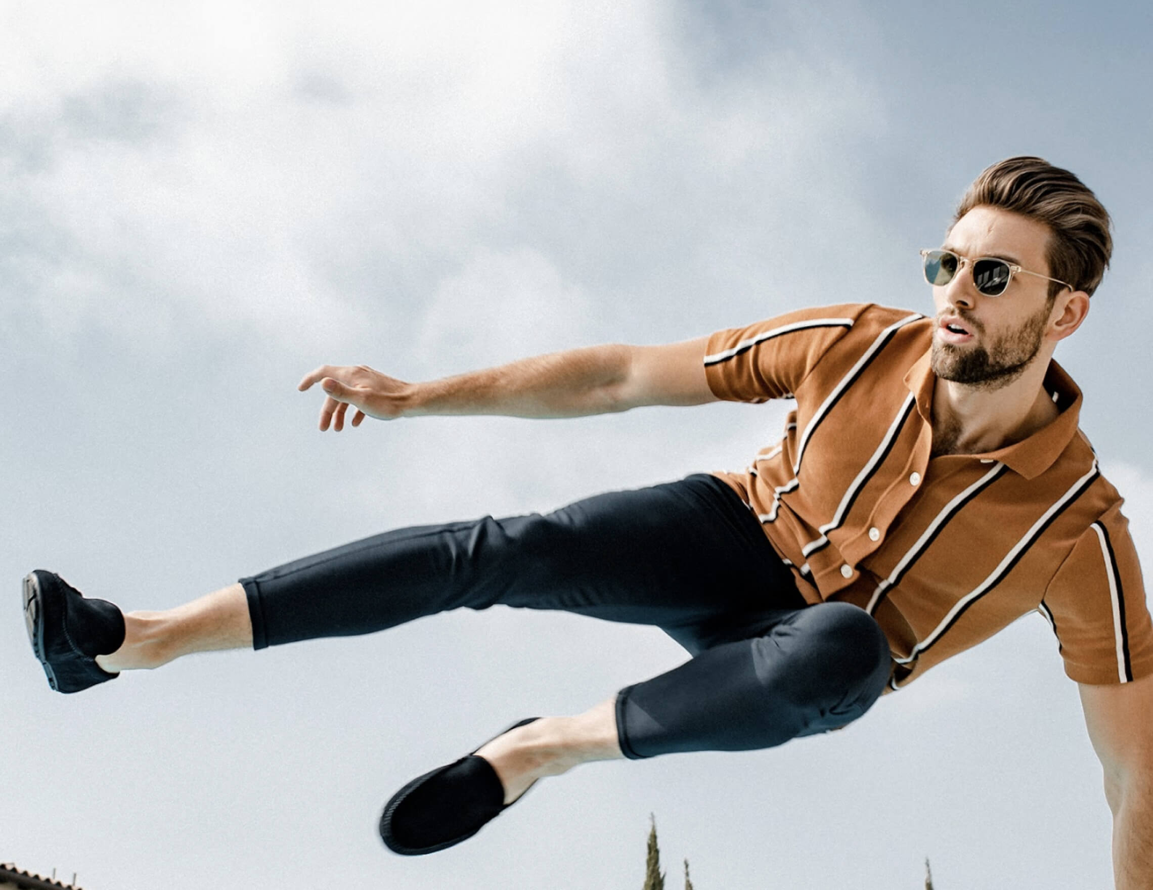 man jumping through the sky