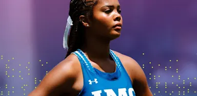 Focused female track athlete at IMG Academy with eyes closed, practicing mental visualization before a race.
