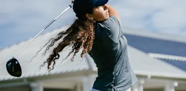 IMG Academy student-athlete follows through on a golf swing