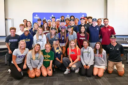 Group of IMG Academy student-athletes wearing college apparel, celebrating their recruitment to various NCAA programs across multiple sports.