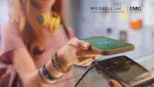 Student using a smartphone to make a contactless payment, with Merrill and IMG Academy logos visible, representing a student guide to managing money and financial literacy.
