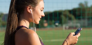 Girl on phone checking social media