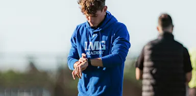 Male looking at his watch.