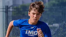 IMG Academy student athlete sprinting during outdoor training, demonstrating speed, focus, and athletic performance.