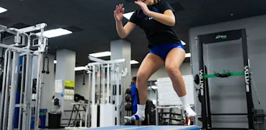 An IMG Academy student-athlete performs box jumps