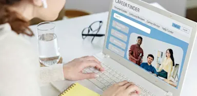 Female on laptop searching for jobs.