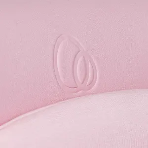 Close-up of the pink vegan leather seat with a tonal embossed Puggle logo and soft jersey liner.