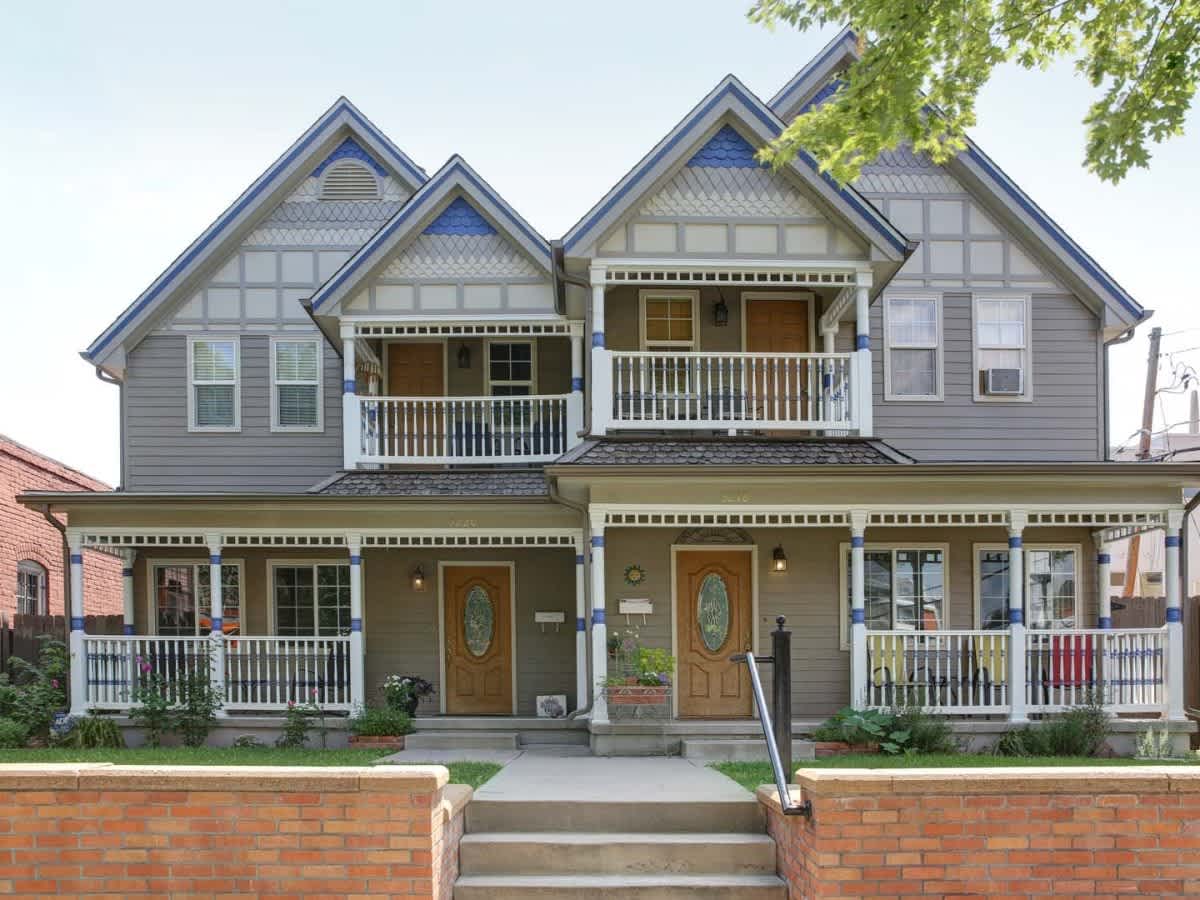 beautiful gray and blue duplex with siding and paint done by Colorado Siding Repair