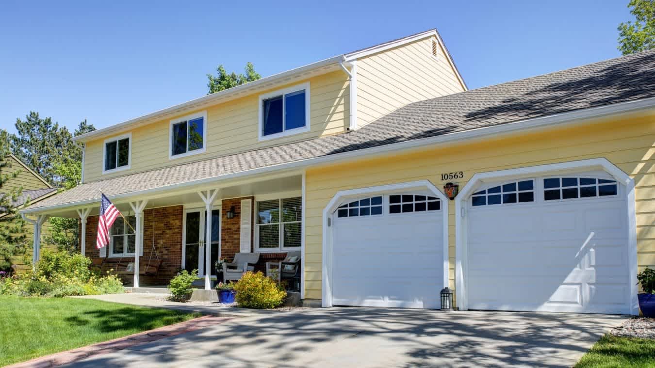 Yellow Home Colorado Siding Repair