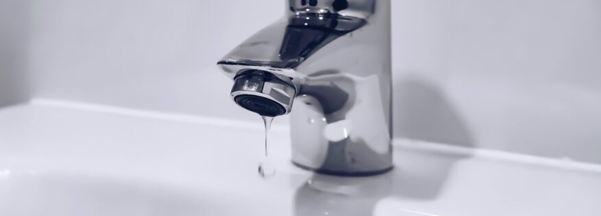 What causes low water pressure in the whole house?