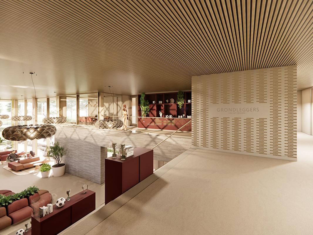 Interieurbeeld van de entreehal met grondleggermuur van het toekomstige FC Twente Topsport Complex Diekman in Enschede