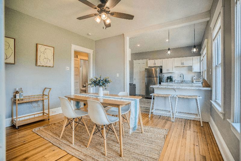 A spacious kitchen and dining room with elegant hardwood floors, creating a warm and inviting atmosphere.