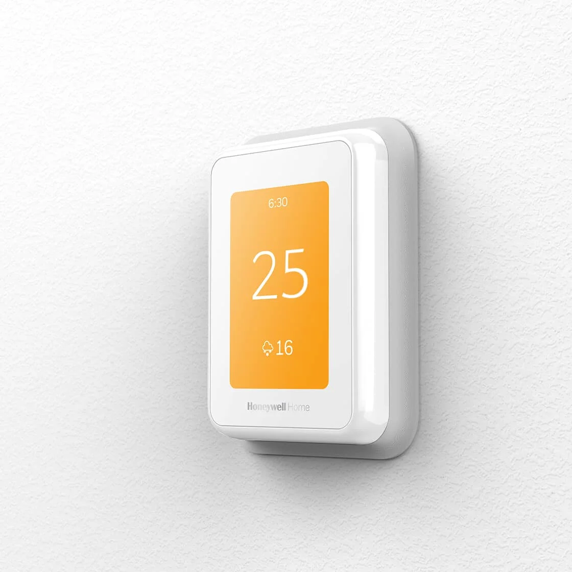 Image of a home's digital thermostat on the wall.