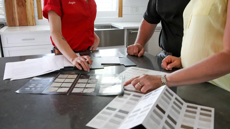 Three people planning a budget