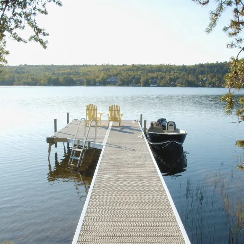 A dock with two lounge chairs 
