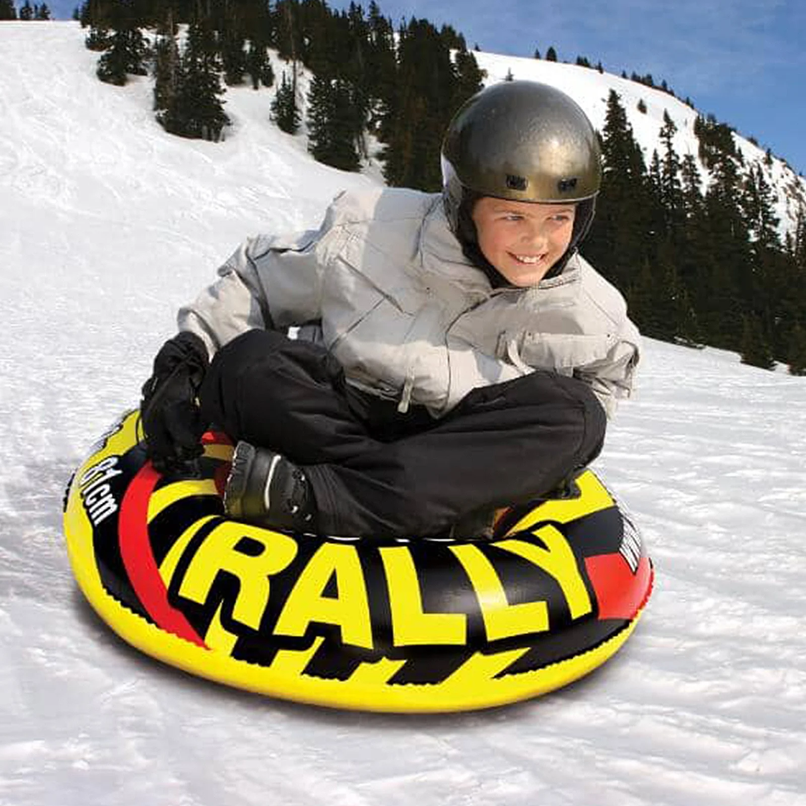 Kid sledding with an inner tube